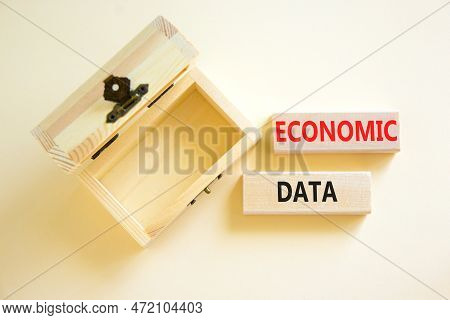 Economic Data Symbol. Concept Words Economic Data On Wooden Block. Beautiful White Table White Backg