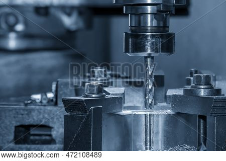 The Plunge Milling  Process On Nc Milling Machine With Coolant Method. The Metal Working Concept On 
