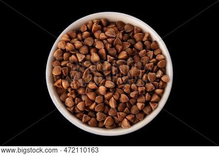 Buckwheat Groats On A Black Background. Macro. Close-up