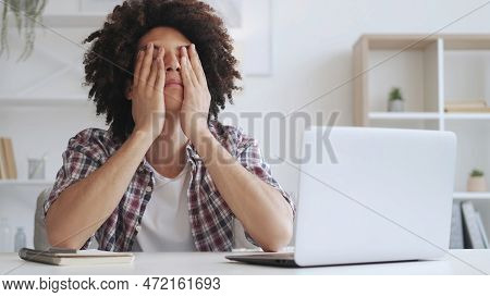 Tired Student. Eyestrain Fatigue. Online Education Overload. Exhausted Guy Working On Computer Takin