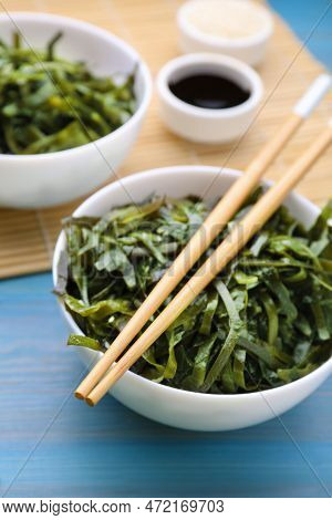 Fresh Laminaria (kelp) Seaweed Served On Light Blue Wooden Table