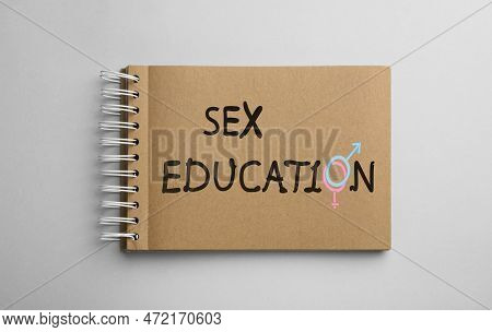 Text Sex Education With Female And Male Gender Signs Instead Of Letter O In Notebook On Light Backgr