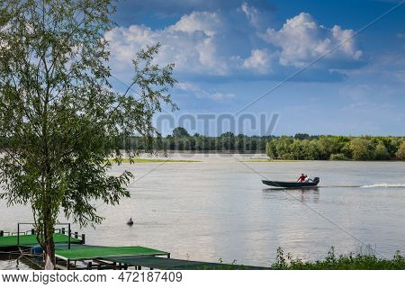 Krcedin, Serbia - June 12, 2022: Old Motorboat, A Speedboat Of Fishermen, Navigating On The Danube R