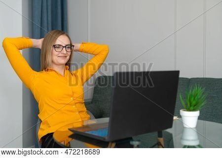 Smiling Satisfied Young Businesswoman In Glasses Finished Computer Work Stretching Sitting At Her De