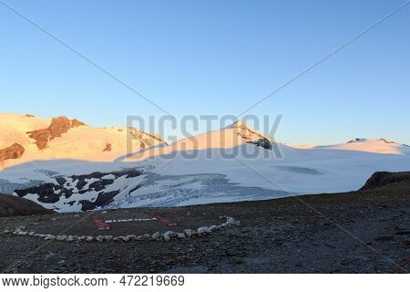 Mountain Snow Panorama, Summit Johannisberg (high Tauern) And Helicopter Landing Site During Sunrise