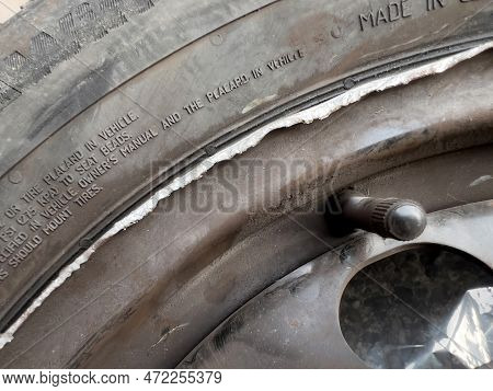 Clermont-ferrand, France - Oct 17, 2022: Damaged Winter Tyre Mounted On A New Rhim Wheel After An Ac