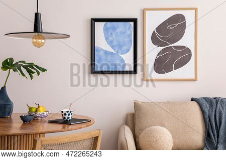 Warm And Cozy Interior Of Living Room Space With Mock Up Poster Frame, Wooden Table, Beige Sofa, Rat