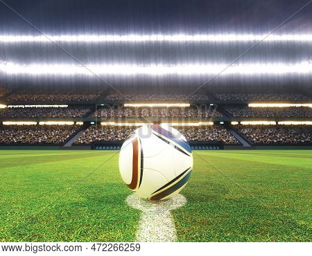 A Soccer Ball On The Centre Line Of A Soccer Stadium With Goals On A Marked Green Grass Pitch Under 