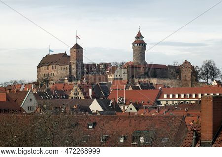 View Of Nuremberg Castle From High Above The Red Roofs, The City Of Nuremberg, Bavaria, Germany. The