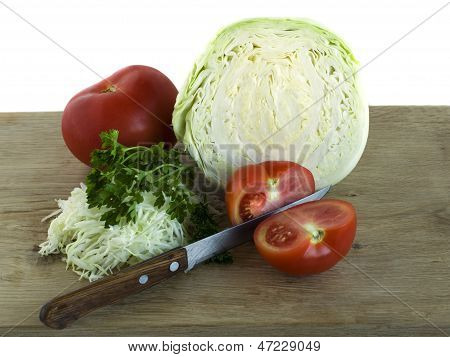 Preparation Of Cabbage Salad With Tomato And Herbs