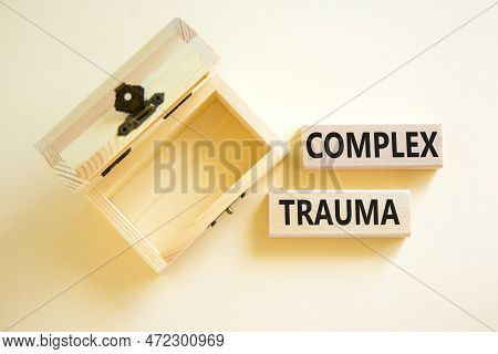 Complex Trauma Symbol. Concept Words Complex Trauma On Wooden Block. Beautiful White Table White Bac