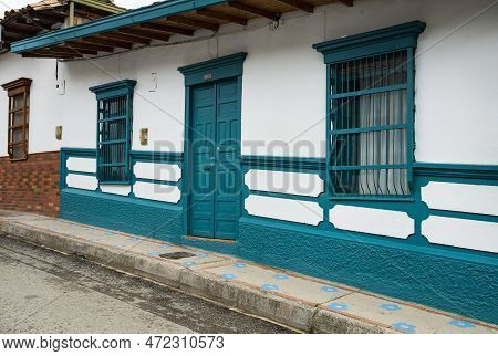 Facade Located In Entrerrios, Antioquia. Traditional Colombian Architecture