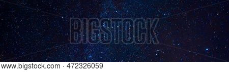 Astrophotography Of A Dark Blue Starry Sky With Many Stars, Nebulae And Galaxies. Panoramic Wide Hor