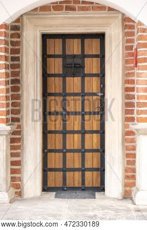 Old Wooden Brown House Door. Gorgeous Wooden Door In The Streets Krakow Poland. Antique Wooden Door 