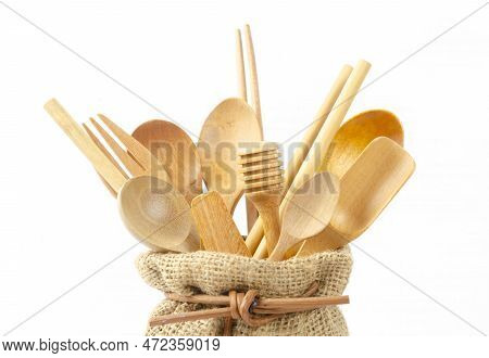 Close-up Wooden Cutlery In Sack Bag On A White Background. Environmentally Friendly Materials.