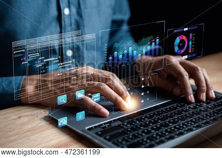 Analyst Working With Computer In Business Analytics And Data Management System To Make Report With K