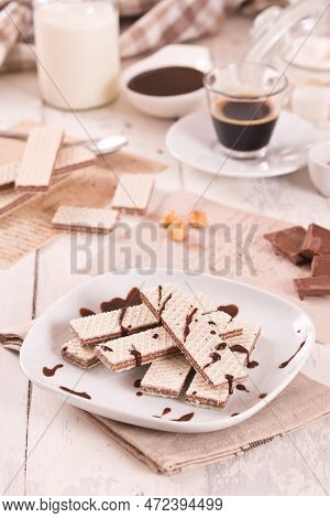 Neapolitan Wafers Filling With Hazelnut-chocolate Cream On White Dish.