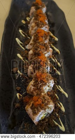 Aburi Salmon Roll Consist Of Crab Meat With Soft Shell Crab, Sushi Rice And Rolled Up. After That, T