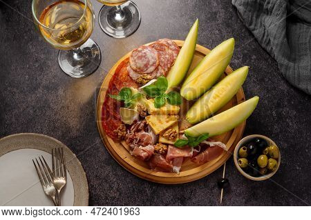 Charcuterie Gourmet Antipasti Plater Cheese, Salami, Prosciutto, Melon Board. Top View
