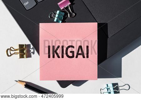 Ikigai. The Word Ikigai On Note Stickers Lying On Laptop. Ikigai Is A Japanese Concept Reason For Be