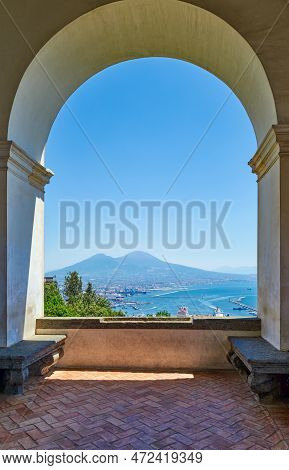 Naples, Italy - July 1, 2019:  Thecity And The Vesuvio Volcan Seen From A Balcony Of The Museum Of T