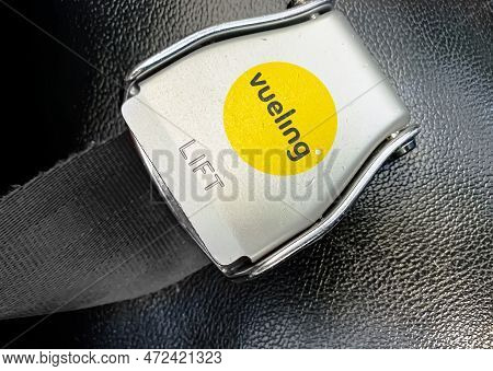 Barcelona, Sp Jan 2023: Detail Of The Buckle Of The Seat Belt With The Logo Of Vueling Airlines On A