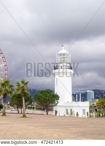 Lighthouse Is Now Defunct. Embankment In Batumi. Beautiful Architecture By The Sea. White Lighthouse