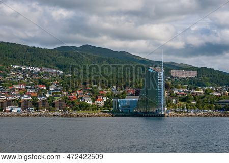 Molde, Norway - July 2019. Modern Architecture On The Background Of Scandinavian Mountains And Blue 