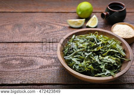Fresh Laminaria (kelp) Seaweed Served On Wooden Table. Space For Text