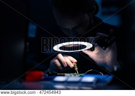 Professional Technician Checking And Repairing Part Of Automatic Machine