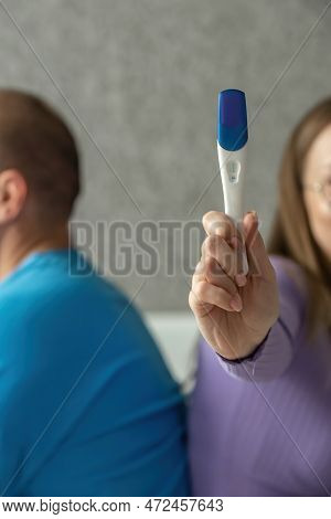 Negative Pregnancy Test In The Hands Of A Young Woman. Conscious Denial Of Pregnancy, Childfree. Sel