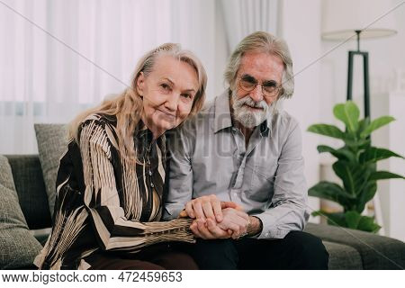 Couple Of Happy Senior People Smiling And Looking At Camera