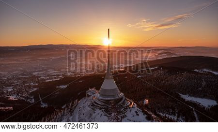 A bird's eye view of snow-covered Jested at sunrise. Photographed on the Jested ridge by drone. Beau