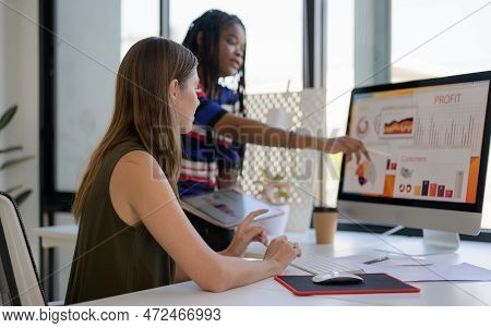 Happy Female Dressmaker Working In Workshop Studio