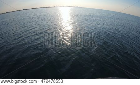 Seascape, View Of Sea Waves With Sun Reflection From Prow Of Motorboat. Boat Jumping On Waves On Sun