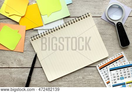 Blank Yellow Sticky Paper, Notepad On Work Desk, Pencil And Calendar And Desk Background