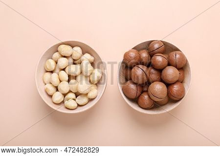 Delicious Organic Macadamia Nuts On Beige Background, Flat Lay