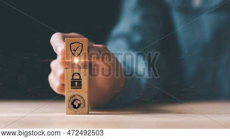 Human Hand Holding A Wooden Block , Cyber Security Protection ,protecting Data From Theft ,secure Lo