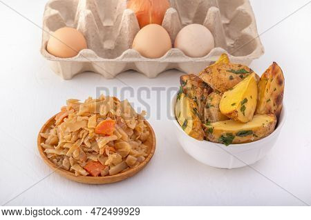 Braised Cabbage - Bigos And Grilled Sausage In A White Porcelain Plate Against The Background Of Chi