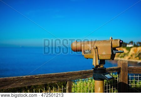 On A Bright Cloudless Day, A Telescope For Sight-seers And Tourists Overlooks The Deep Blue Ocean Of