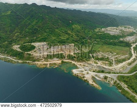 Aerial View Of Mining Quarry With Flooded Bottom. Lake With Blue Water Near Sand Pit. Sipalay, Negro