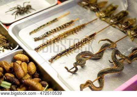 Exotic Food In Khao San Road At Night In Bangkok City, Thailand, Holidays And Traveling Concept