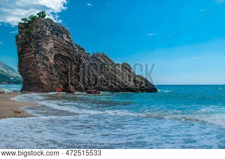 Beautiful Rocks On Pebble Public Stone Beach. Rafailovici Esort Towns. Mountenegro. Adriatic Sea. Su