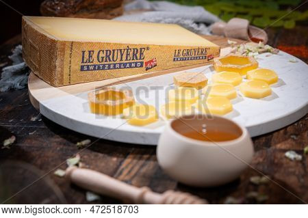 July 12 2022, Lyon, France : Tasted Famous Swiss Cheese : Le Gruyere With Honey For Lunch And Food E