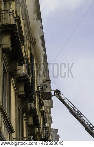 Editorial, Domestic Apartment Fire With Smoke Billowing From Window. Garibaldi Square, Naples, Italy