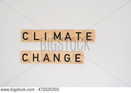 Wolverhampton, England - April 12 2023: 
 Wooden Title Spelling The Words Climated Change Isolated O