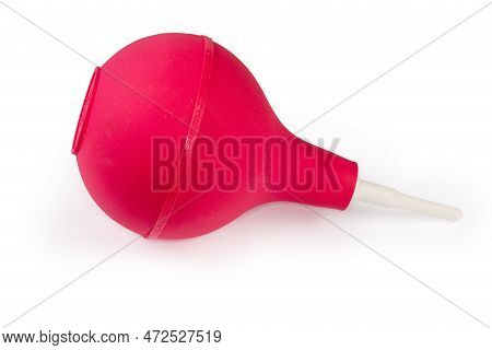 Red Polyvinyl Bulb Syringe With White Plastic Nozzle On A White Background