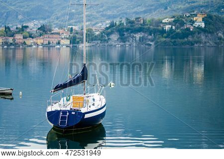 Colourful Yacht Docked At Marina Of Lecco Town On Spring Day. Picturesque Waterfront Of Lecco Locate