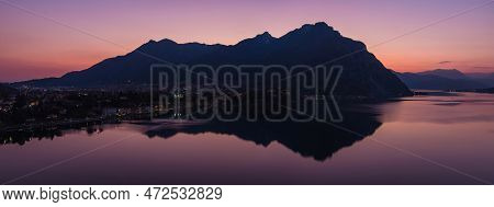 Stunning Aerial Cityscape Of Lecco Town On Spring Evening. Picturesque Waterfront Of Lecco Town Loca