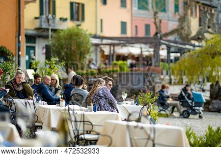Varenna, Italy - April 2022: Tourists And Locals Spending Sunny Spring Day In Varenna, A Town On The